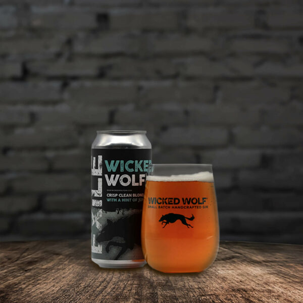 Can of Wicked Wolf Ale next to a full glass of beer