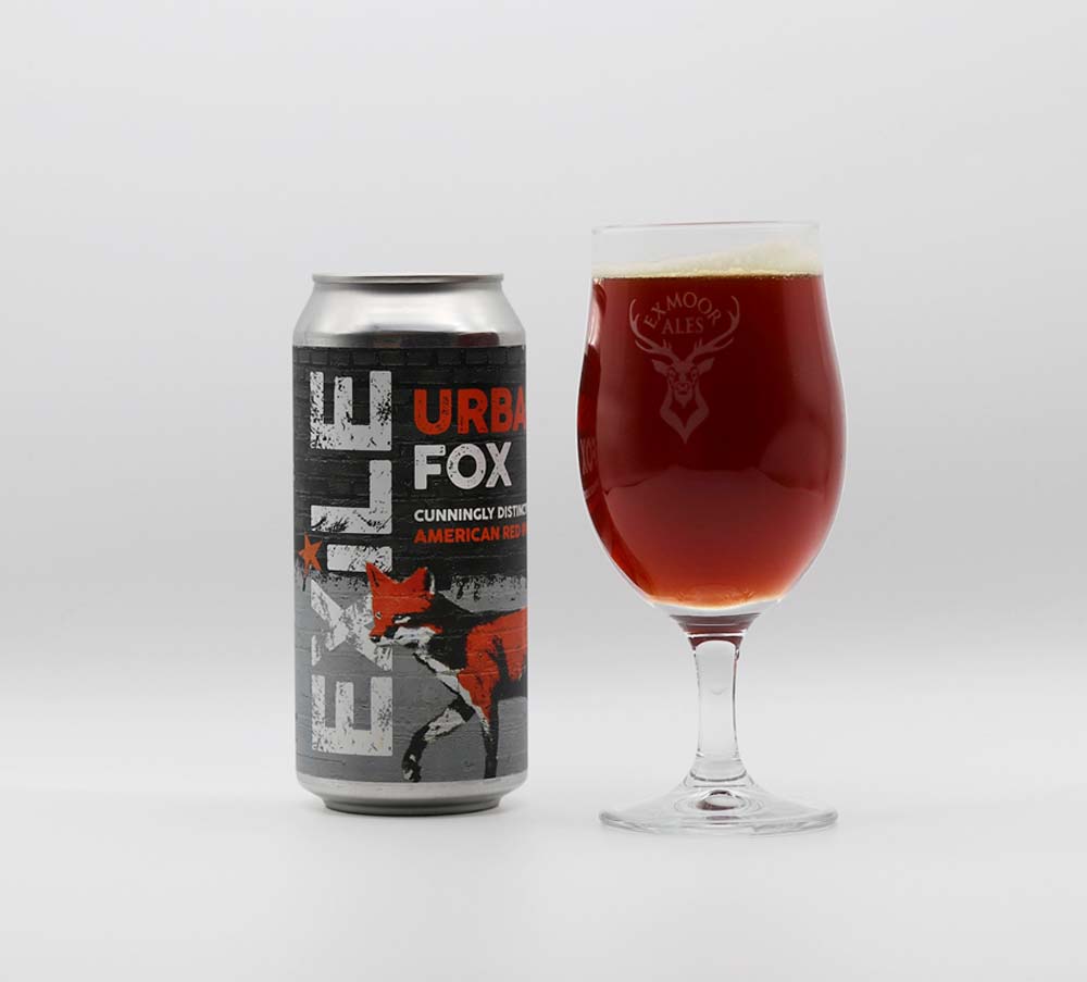Can of Urban Fox ale next to a full stemmed glass of beer