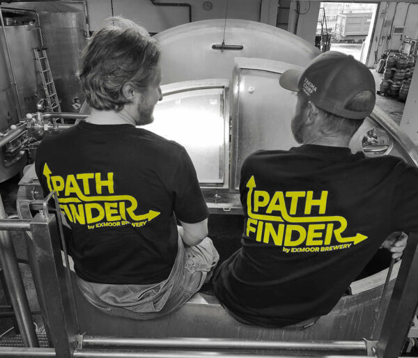 Two brewers shown from the back wearing black t-shirts with Pathfinder logo on it